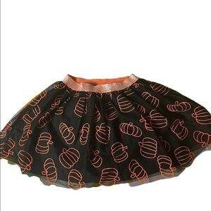 Black tutu orange pumpkins adorn this adorable fall Cat & Jack skirt
